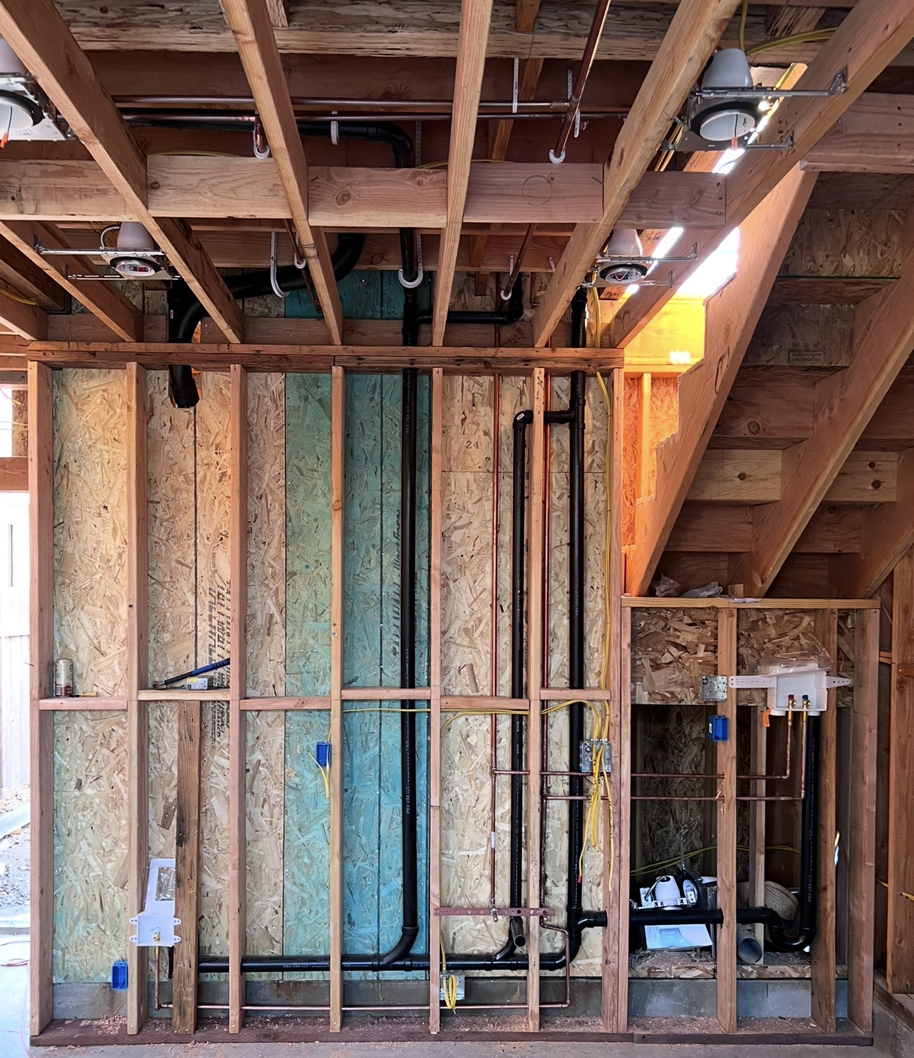 ADU and new home plumbing installation inside open framing